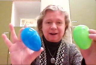 Peggy holding coloured plastic eggs